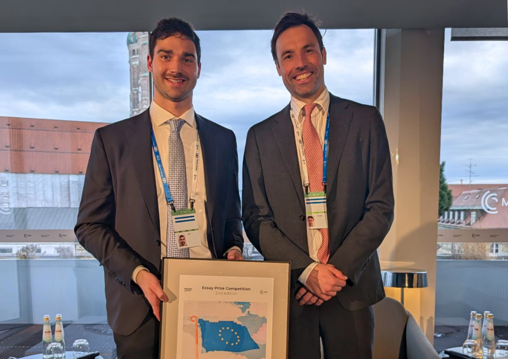 Max Smeets and Josh Gold, awarding the Essay Prize Competition